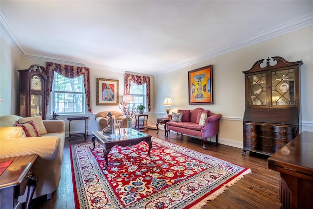 living area featuring ornamental molding, dark wood-style flooring, and baseboards