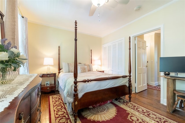 bedroom featuring wood finished floors, crown molding, and a ceiling fan