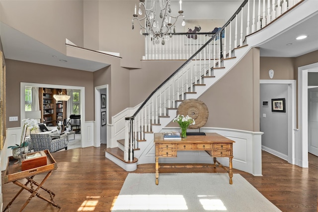 2 Cerf Ln, Mount Kisco, NY 10549 - entrance foyer with stairs, wood finished floors, a towering ceiling, wainscoting, and a chandelier