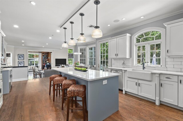 2 Cerf Ln, Mount Kisco, NY 10549 - kitchen featuring stainless steel dishwasher, a sink, recessed lighting, a center island, and decorative backsplash