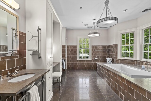 2 Cerf Ln, Mount Kisco, NY 10549 - bathroom with tile walls, wainscoting, a bath, tile patterned floors, and vanity