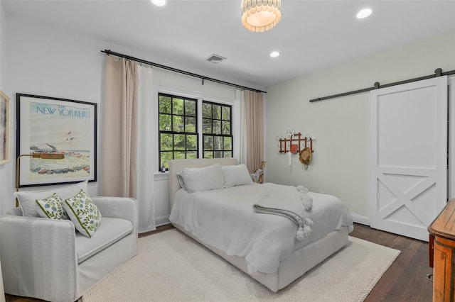 2 Cerf Ln, Mount Kisco, NY 10549 - bedroom with a barn door, recessed lighting, and wood finished floors