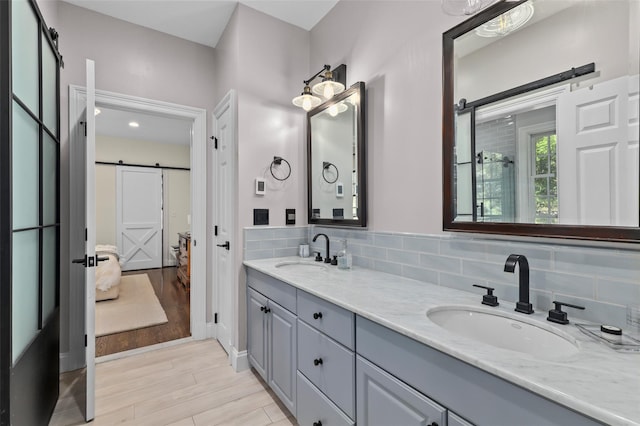 2 Cerf Ln, Mount Kisco, NY 10549 - full bath with double vanity, wood finished floors, and decorative backsplash
