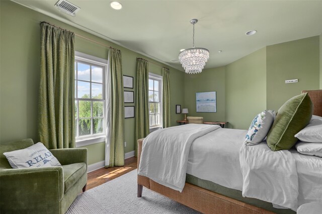 2 Cerf Ln, Mount Kisco, NY 10549 - bedroom with a chandelier, wood finished floors, recessed lighting, and baseboards