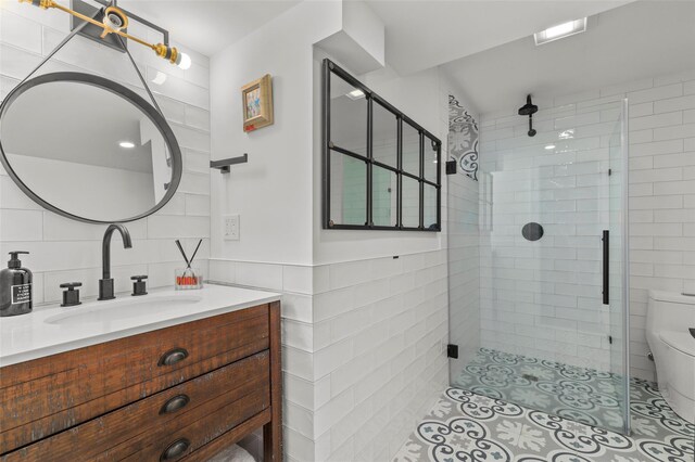 2 Cerf Ln, Mount Kisco, NY 10549 - full bathroom with tile walls, a stall shower, toilet, and vanity
