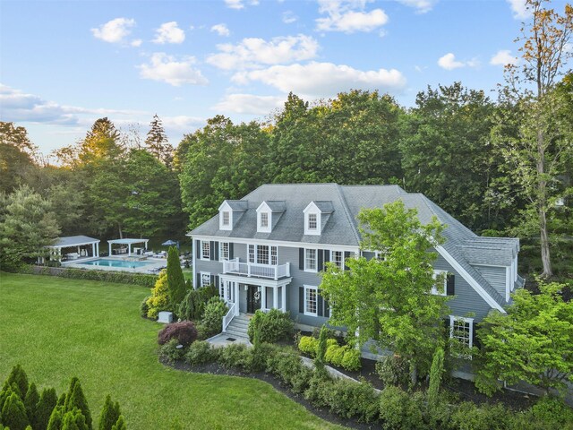 2 Cerf Ln, Mount Kisco, NY 10549 - colonial inspired home with an outdoor pool, a front yard, and a balcony