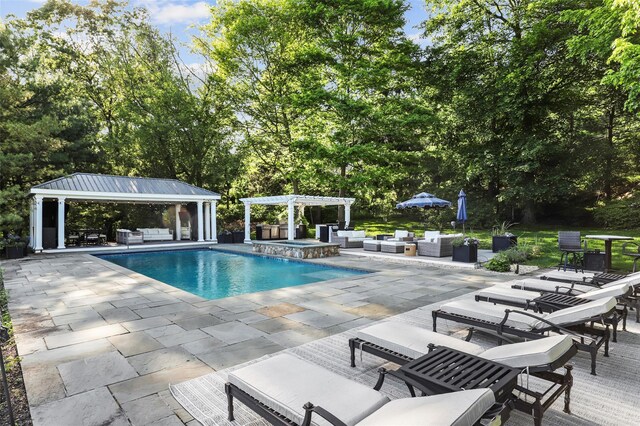2 Cerf Ln, Mount Kisco, NY 10549 - view of swimming pool with an outdoor living space, a pergola, a patio, and view of wooded area
