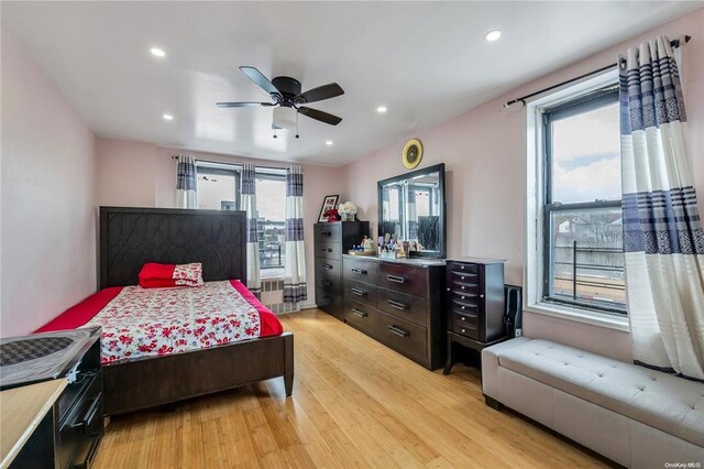 bedroom featuring light wood-style floors, recessed lighting, and a ceiling fan