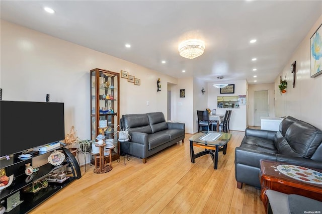 living room featuring light wood-style floors and recessed lighting