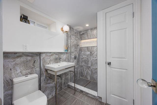 7203 Ingram St, Forest Hills, NY 11375 - full bathroom with tile walls, a walk in shower, toilet, and a sink