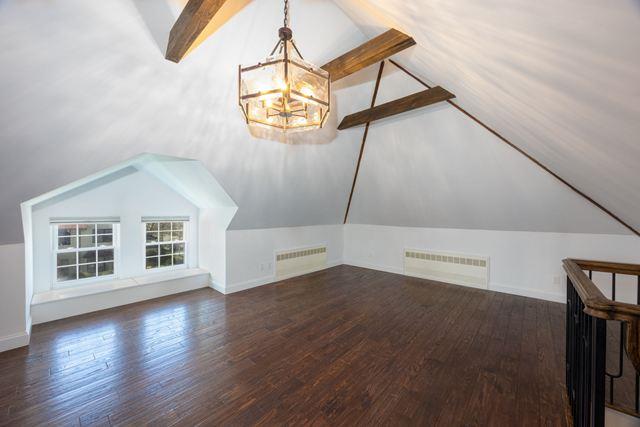 7203 Ingram St, Forest Hills, NY 11375 - bonus room featuring a chandelier, wood finished floors, and baseboards