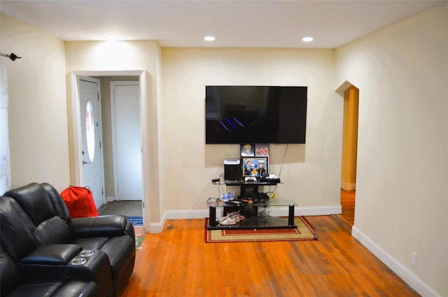 110 Powell Pl, Hempstead, NY 11550 - living area with wood finished floors, baseboards, and recessed lighting