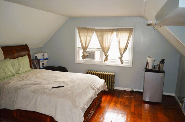 110 Powell Pl, Hempstead, NY 11550 - bedroom featuring radiator, lofted ceiling, cooling unit, dark wood finished floors, and baseboards