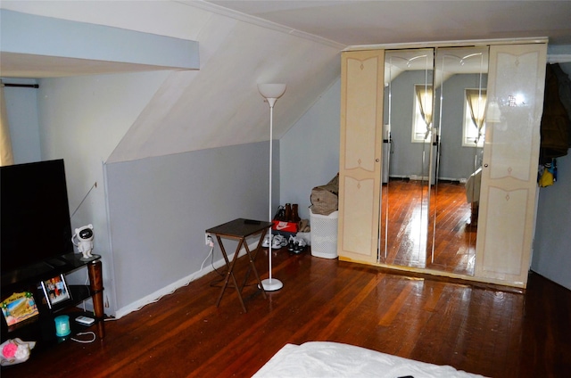 110 Powell Pl, Hempstead, NY 11550 - additional living space featuring hardwood / wood-style floors, vaulted ceiling, and baseboards