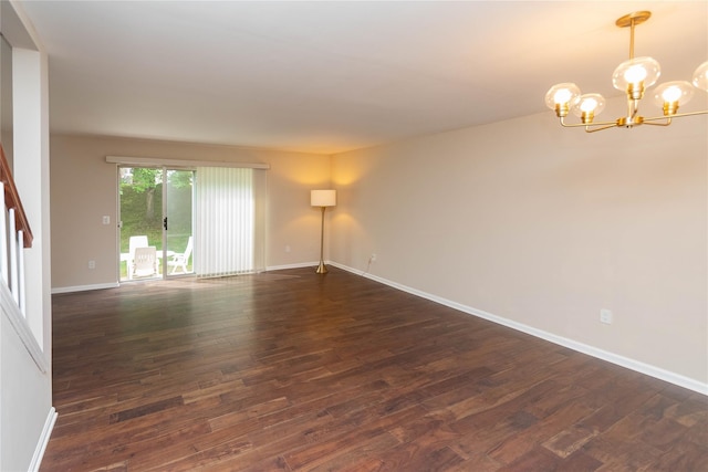 9 Clara Ct, Cortlandt Manor, NY 10567 - unfurnished room featuring dark wood finished floors, a chandelier, and baseboards