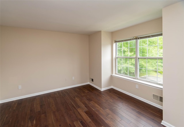 9 Clara Ct, Cortlandt Manor, NY 10567 - unfurnished room featuring baseboards and dark wood-style flooring