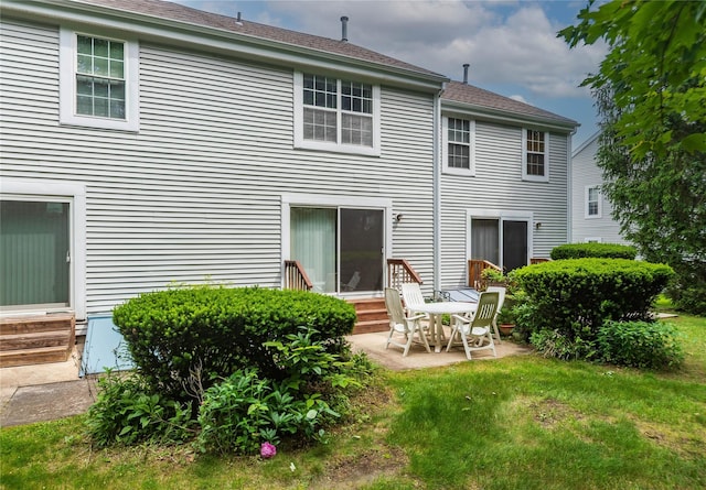9 Clara Ct, Cortlandt Manor, NY 10567 - back of property with entry steps, a patio area, and a yard