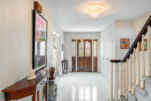 1 Karin Ct, East Northport, NY 11731 - entrance foyer featuring stairs, healthy amount of natural light, light tile patterned floors, and a chandelier