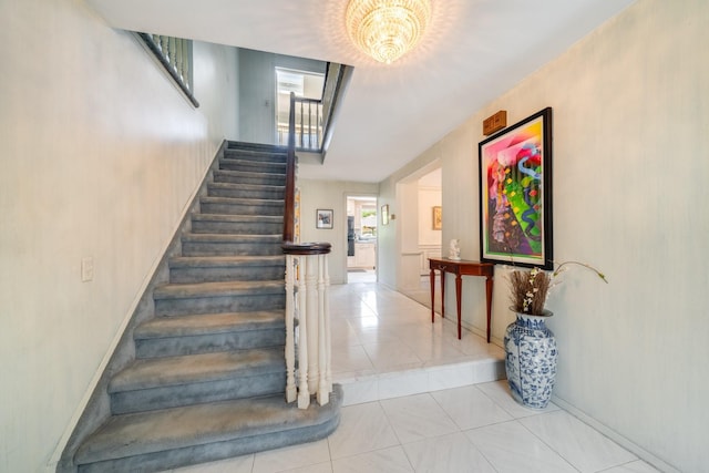 1 Karin Ct, East Northport, NY 11731 - stairs with tile patterned flooring and baseboards
