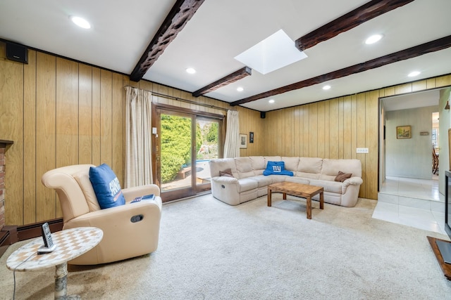 1 Karin Ct, East Northport, NY 11731 - carpeted living room with a skylight, beam ceiling, wooden walls, and recessed lighting