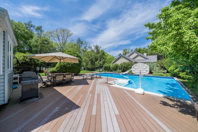 1 Karin Ct, East Northport, NY 11731 - swimming pool featuring a wooden deck, outdoor dining space, and a water slide