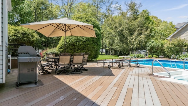 1 Karin Ct, East Northport, NY 11731 - deck featuring outdoor dining space, an outdoor pool, view of wooded area, area for grilling, and a hot tub