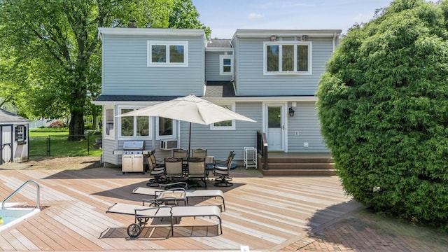 1 Karin Ct, East Northport, NY 11731 - back of property featuring a wooden deck, fence, roof with shingles, and cooling unit
