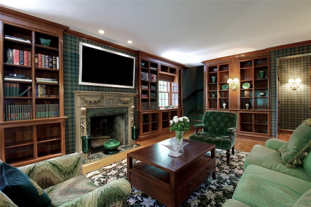 living room featuring a premium fireplace and recessed lighting
