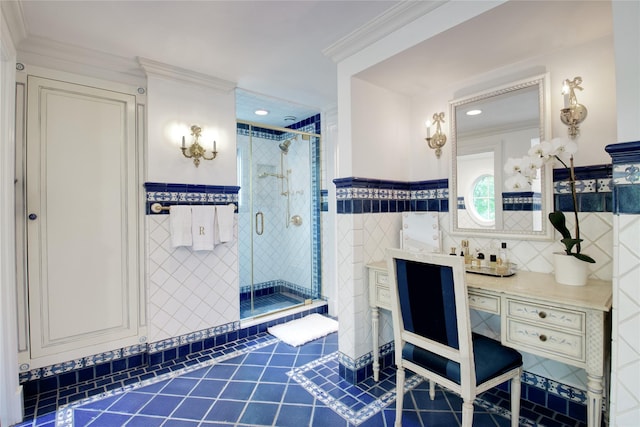 bathroom with tile walls, a shower stall, tile patterned flooring, ornamental molding, and vanity