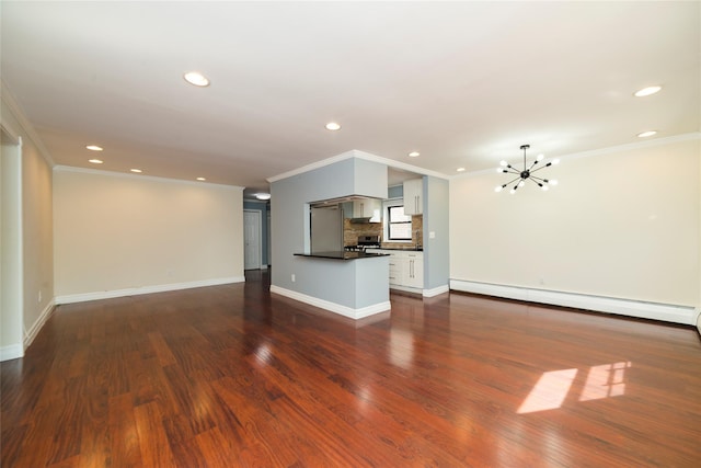 unfurnished living room with crown molding, recessed lighting, baseboard heating, a chandelier, and dark wood finished floors