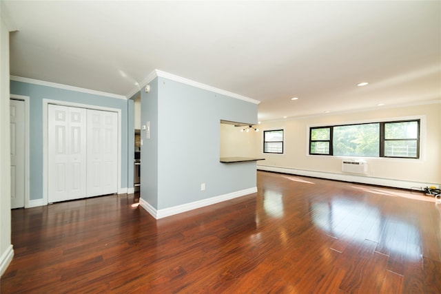 unfurnished living room with ornamental molding, wood finished floors, a wall mounted air conditioner, baseboards, and recessed lighting