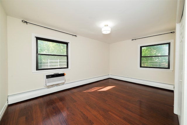 spare room featuring plenty of natural light, dark wood finished floors, baseboards, and baseboard heating