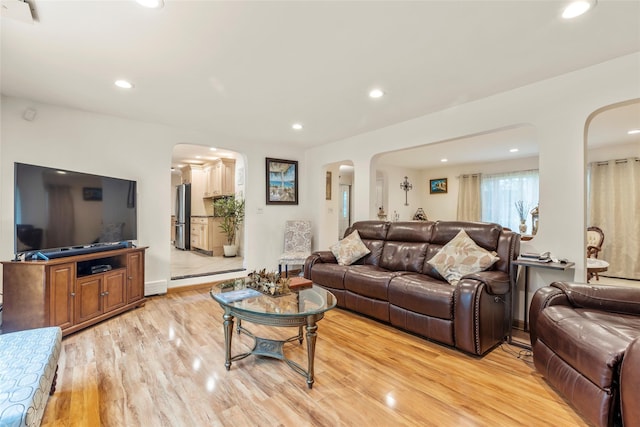8 Wichard Blvd, Commack, NY 11725 - living room featuring arched walkways, light wood-type flooring, recessed lighting, and baseboards