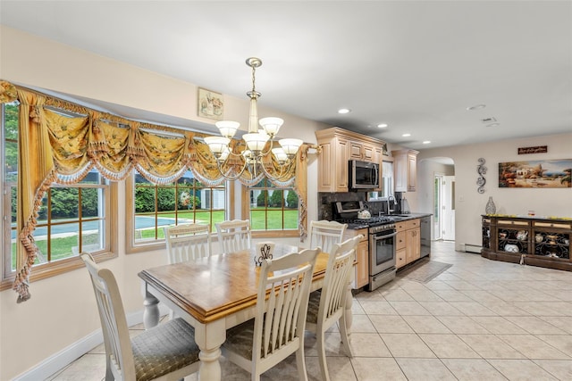 8 Wichard Blvd, Commack, NY 11725 - dining space featuring a chandelier, arched walkways, a baseboard radiator, plenty of natural light, and recessed lighting