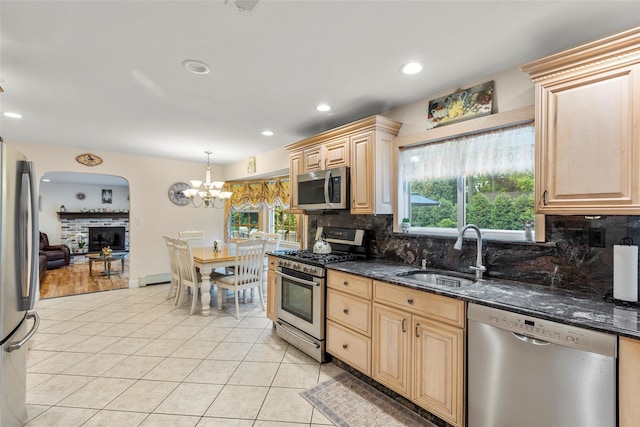 8 Wichard Blvd, Commack, NY 11725 - kitchen with stainless steel appliances, a sink, decorative backsplash, light tile patterned floors, and recessed lighting