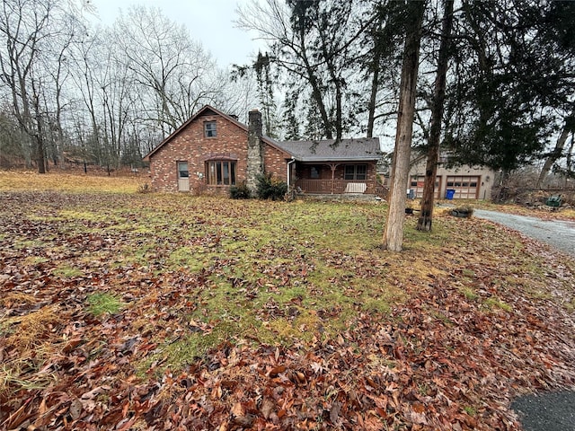 47 River Ln, Bloomingburg, NY 12721 - view of front of home with a chimney and brick siding