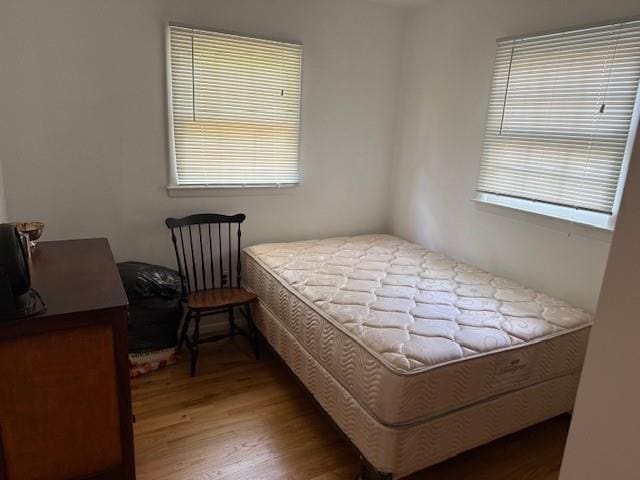 bedroom featuring wood finished floors