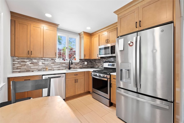 31 Wagon Ln E, Centereach, NY 11720 - kitchen featuring appliances with stainless steel finishes, a sink, light countertops, tasteful backsplash, and light brown cabinetry