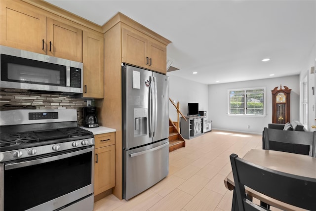 31 Wagon Ln E, Centereach, NY 11720 - kitchen with stainless steel appliances, decorative backsplash, light countertops, recessed lighting, and open floor plan