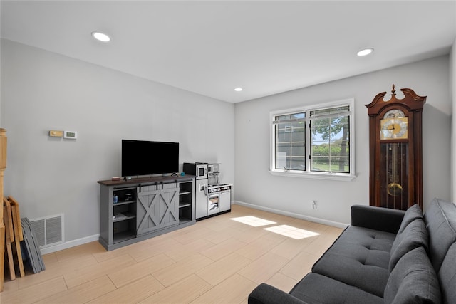 31 Wagon Ln E, Centereach, NY 11720 - living area featuring baseboards, recessed lighting, and light wood-style floors