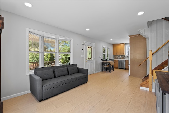 31 Wagon Ln E, Centereach, NY 11720 - living room with stairway, baseboards, and recessed lighting