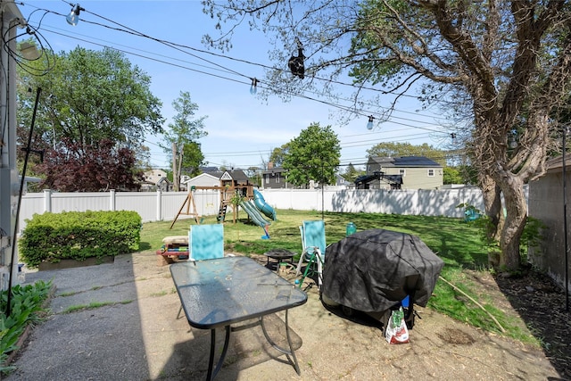 31 Wagon Ln E, Centereach, NY 11720 - view of patio featuring a playground