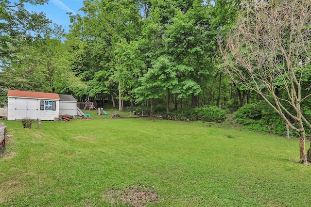 10 Van Wyck Dr, Poughkeepsie, NY 12601 - view of grassy yard with an outbuilding and a storage shed