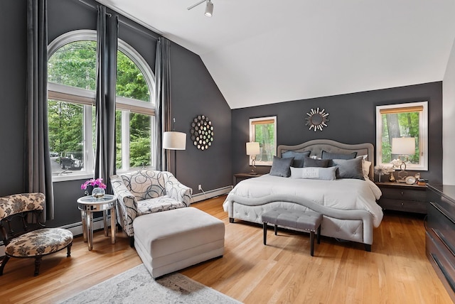 12 Rockridge Rd, Ardsley, NY 10502 - bedroom with baseboard heating, lofted ceiling, and wood finished floors
