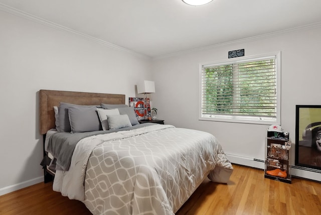 12 Rockridge Rd, Ardsley, NY 10502 - bedroom featuring baseboard heating, crown molding, light wood-style flooring, and baseboards