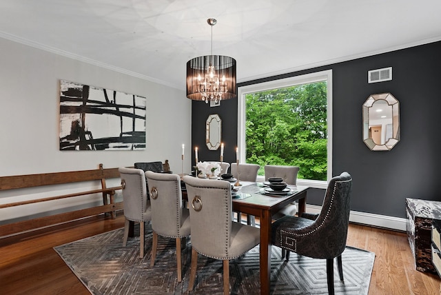 12 Rockridge Rd, Ardsley, NY 10502 - dining space with a chandelier, wood finished floors, crown molding, baseboards, and baseboard heating