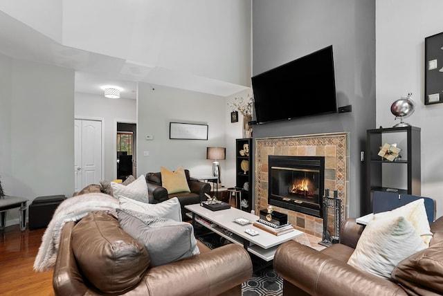 12 Rockridge Rd, Ardsley, NY 10502 - living room featuring wood finished floors, a towering ceiling, and a tile fireplace