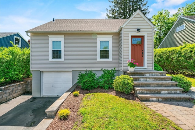 14 Mercer St, Middletown, NY 10940 - view of front of house with a garage, asphalt driveway, and a shingled roof