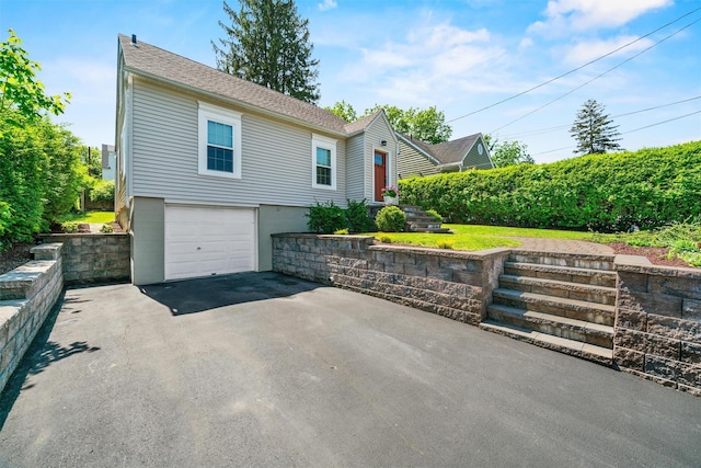 14 Mercer St, Middletown, NY 10940 - view of front of property featuring asphalt driveway, a garage, and roof with shingles