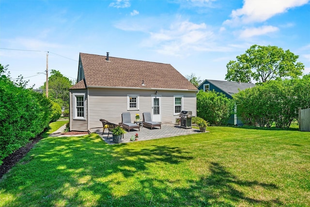 14 Mercer St, Middletown, NY 10940 - back of property featuring a yard, roof with shingles, a patio area, and an outdoor living space